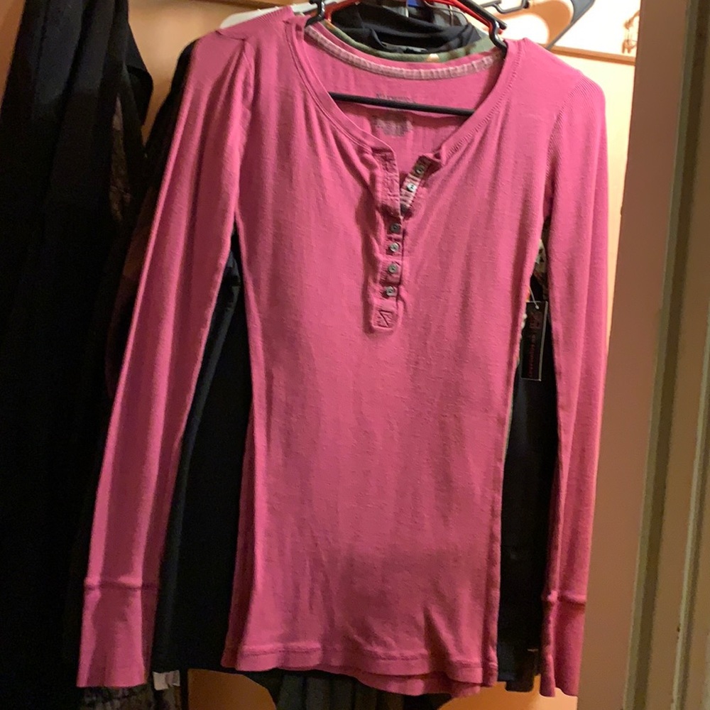 Solid pinkish purple long sleeve shirt 7 buttons down from the neck line